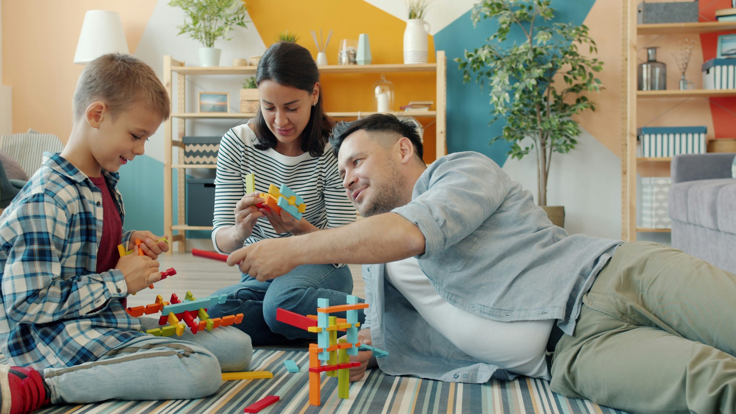 child playing with his full time foster parents